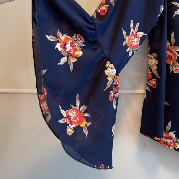 Blue lightweight top with flowers and bell sleeves. - Picture 2 of 6